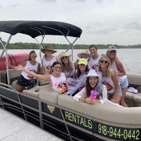 a group of people sitting on a boat