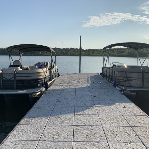 a boat is docked next to a body of water