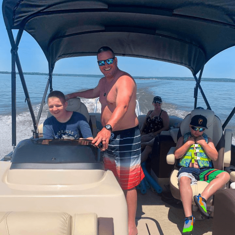 a group of people on a boat in the water