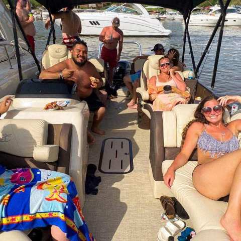 a group of people sitting on a boat