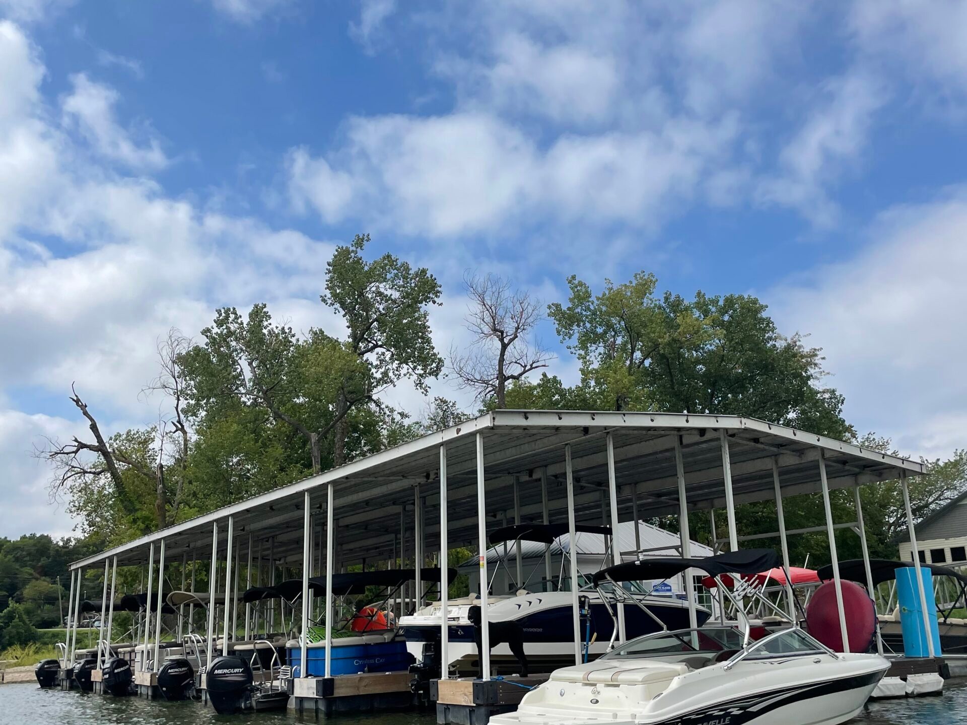 a boat is docked next to a body of water